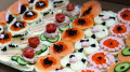 Gourmet Canapés with Salmon, Caviar, and Fresh Toppings - Image 4